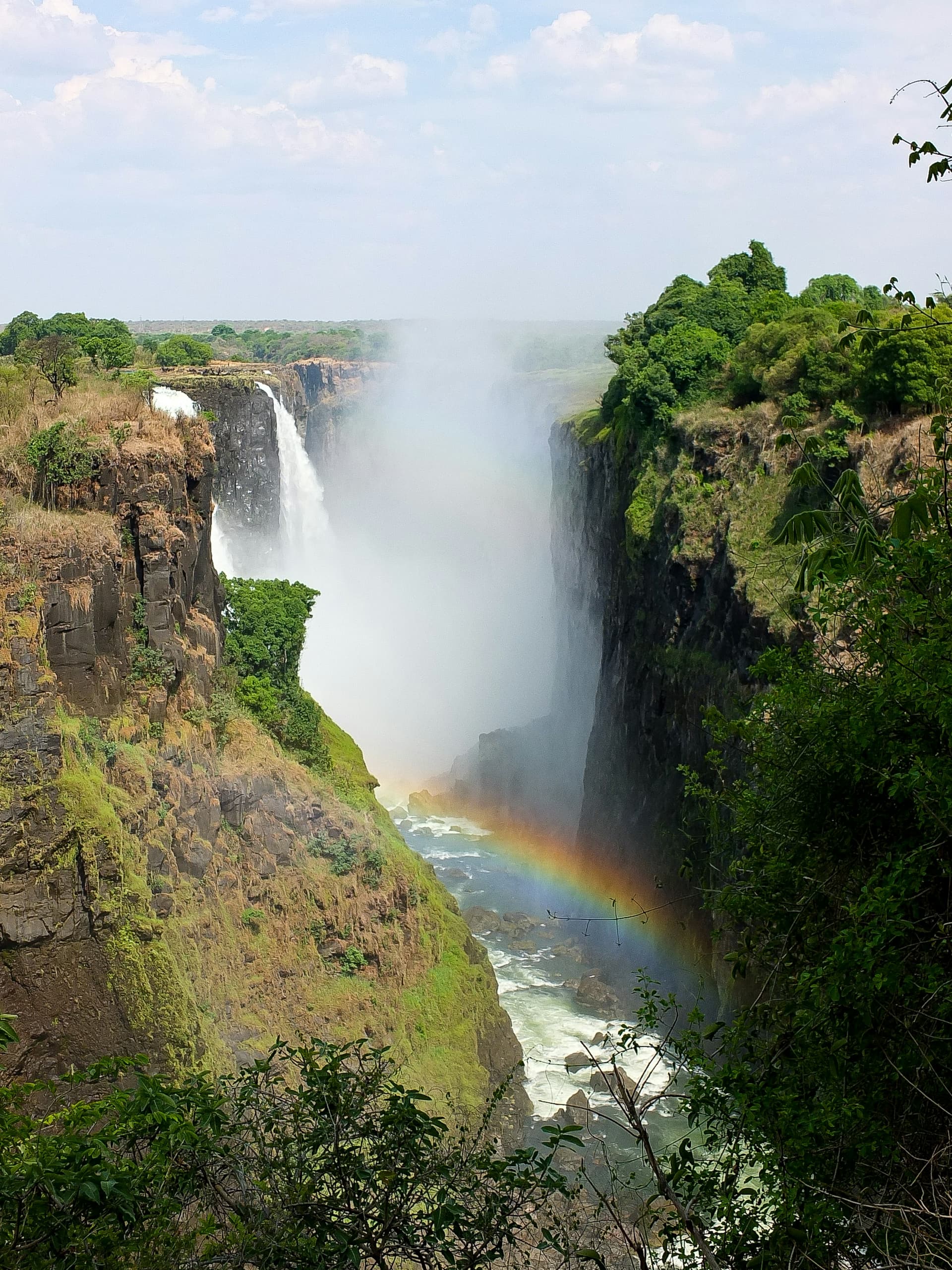 Victoria Falls, Zimbabwe — rainbow over the gorge
